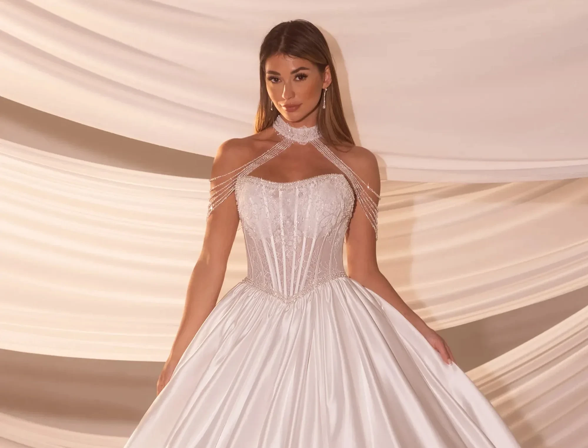Model wearing a gown by Rachel Allan