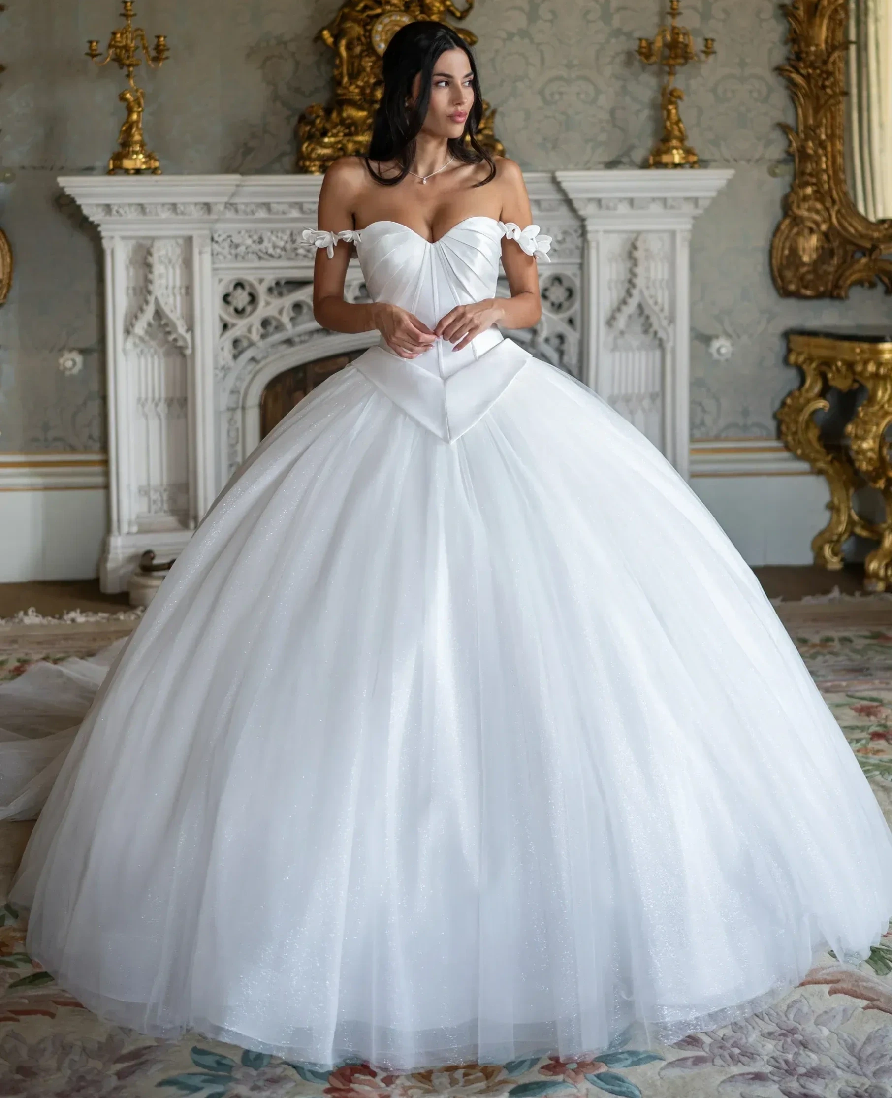 Model wearing a gown by Rachel Allan